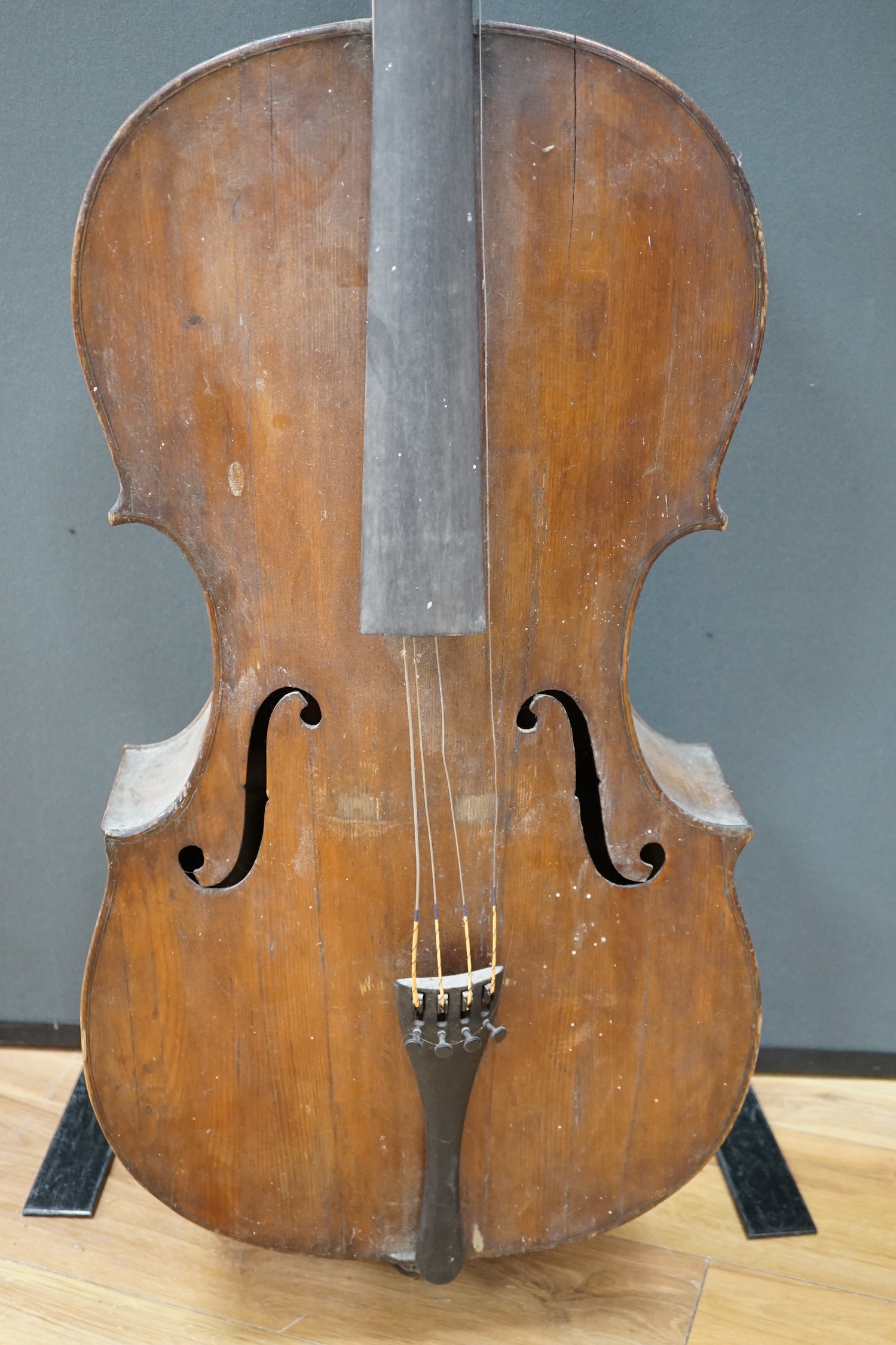 An early 20th century cello for restoration, indistinct internal label; ‘Restored by William J. Acton, Green Street, Forest Gate, London 1910’ length of body 72cm.